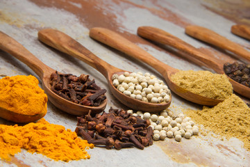 Aromatic spices on wooden spoons. Food ingradients.


