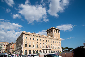 Fototapeta premium Piazza Venezia is a major circus and the central hub of Rome, Italy, in which many thoroughfares intersect, like Via dei Fori Imperiali and Via del Corso.