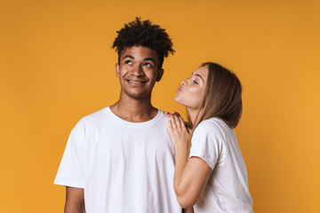 Portrait of man kissing woman on mens cheek