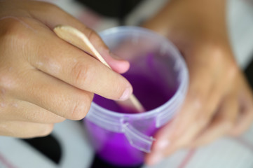 Little girl makes a homemade slime. Selective focus.
