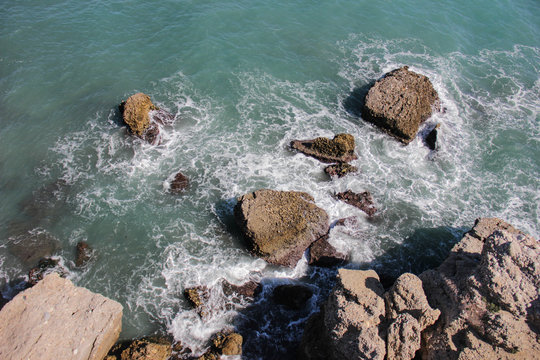 Angular shot of rocks on the sea