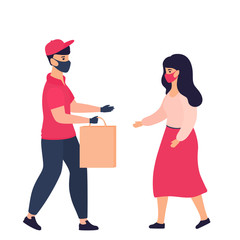 A courier wearing a protective mask and gloves delivers for woman purchase. Safe delivery during the COVID-19 coronavirus pandemic.