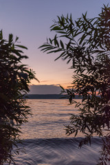 Evening view of the lighthouse and the water. Sunset mode.
