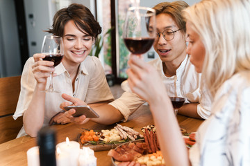 Cheerful happy friends having party via video call