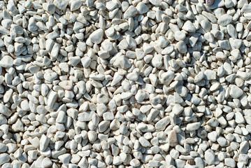 Drainage systems from small pebbles. Garden drainage for plants and trees. White stones for roads and flower beds.