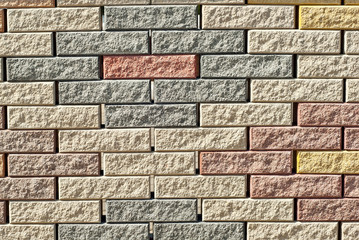 exture of brick wall. new brickwork. Samples of wall or fence are presented at exhibitions. Brown brick close up.