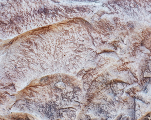 decorative texture of the wall under the stone