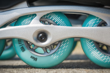 Close up of inline roller skates with blue wheels. Extreme sport. Concept about sport and leisure....