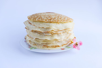 Stack of tasty pancakes on white background
