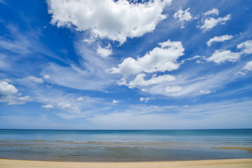 seascape white sand beach with clear wave water and blue sky with white clouds at sountern sea of Thailand