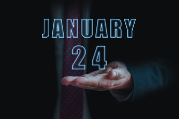 january 24th. Day 24 of month, announcement of date of  business meeting or event. businessman holds the name of the month and day on his hand.. winter month, day of the year concept
