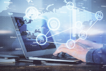 Social network theme hologram with businessman working on computer on background. Concept of world wide web. Multi exposure.