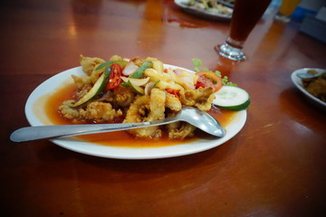 Sweet and sour calamari, the basic ingredients of squid and fresh vegetables with soy sauce