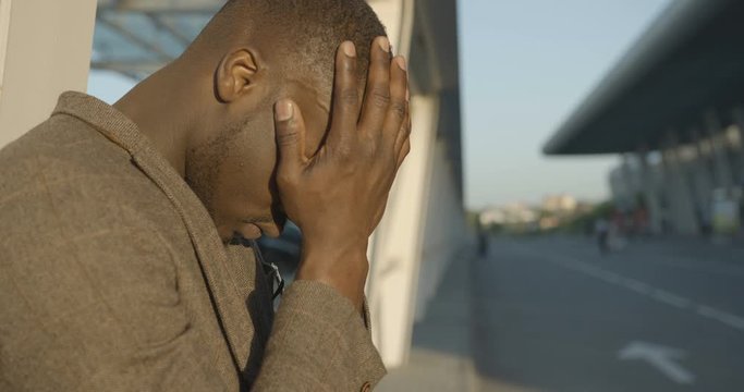 African Young Man in Troble Serious Problems Depressed Upset Close Face 4k Despair Outdoor Side Portrait One Alone.