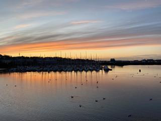 Howth Harbour during sunset.