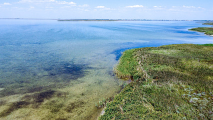 Top view of a beautiful lake with blue transparent water