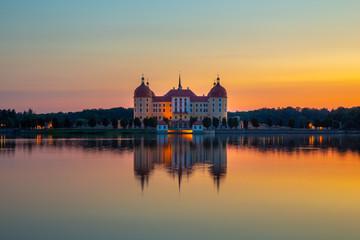 Obraz na płótnie Canvas Beautiful evening panorama of Moritzburg Baroque palace surrounded by a lake.