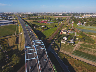 Highway near capital city, bypass of large city. Drone, aerial view.