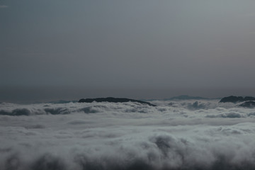 Aerial view of mountain covered with clouds