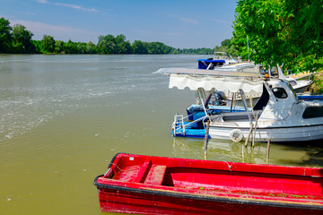 Fototapeta premium Motor boats are docked in the shallow water
