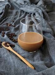 Latte coffee standing on gray cover, isolated background