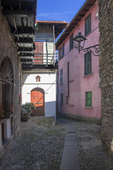stone houses and cobblestone alley of a northern italian village