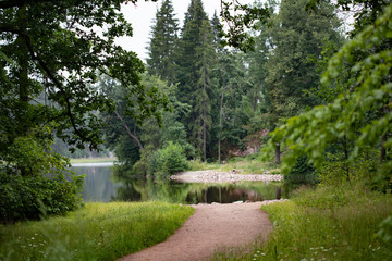Fototapeta na wymiar Rocks and trees reflected in the lake water