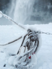 Fototapeta premium Frozen rope in winter. Huge icicles close up