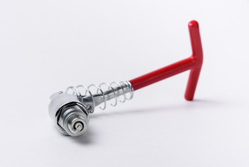 Car spark plugs and key on white background