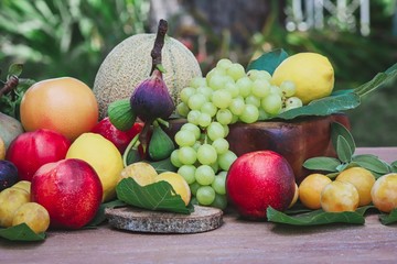 variety of fruit on wooden table - concept of freshness and naturalness