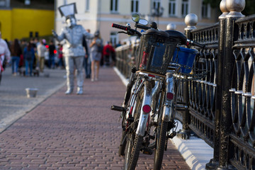 Fototapeta na wymiar bicycles are strapped to the bridge railing