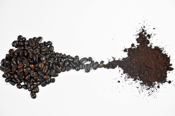 Roasted coffee beans becoming ground coffee on a white background