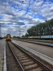 Fototapeta na wymiar At the Slovkurort railway station on a summer day with heavy clouds