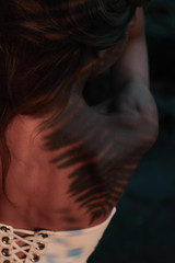 fern shadow on the girl's back