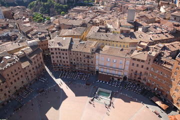 Aerial view of historic town square Piazza del Campo seen and Siena city  from Mangia Tower  in ...