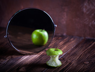 Apple reflecting in the mirror surrealistic picture abstract vision , concept you are not you how...