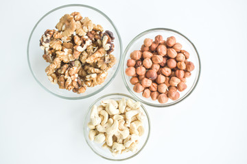 Hazelnuts, cashews, walnuts on a plate. Healthy food, vitamins omega 3, omega 6, calcium, magnesium.