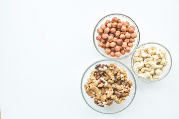 Hazelnuts, cashews, walnuts on a plate. Healthy food, vitamins omega 3, omega 6, calcium, magnesium.
