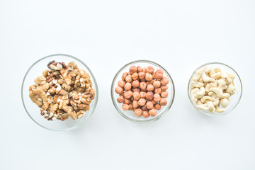 Hazelnuts, cashews, walnuts on a plate. Healthy food, vitamins omega 3, omega 6, calcium, magnesium.