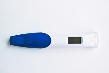 Pregnancy test on a white background. Electronic pregnancy test close-up.