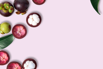 Top view Mangosteens isolated on pink background.