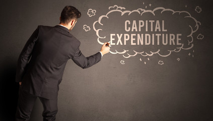 businessman drawing a cloud with CAPITAL EXPENDITURE inscription inside, modern business concept