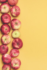 Background with Raw Red Apples Yellow Background Autumn Harvest Background Top View Vertical