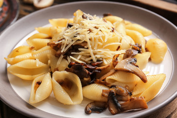 Plate with tasty conchiglie pasta, closeup