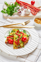 frittata, omelet with sausages on a plate