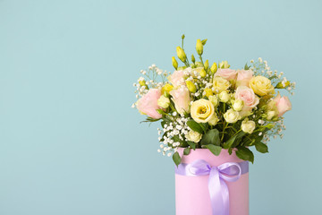 Bouquet of beautiful flowers on color background