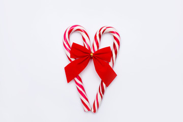 lovely Christmas candy cane in heart form isolated on white