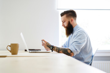 Man with gadgets at table