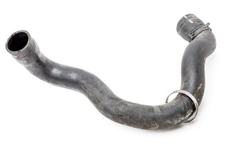 Black plastic engine cooling radiator hose on white isolated background in a photography studio for...