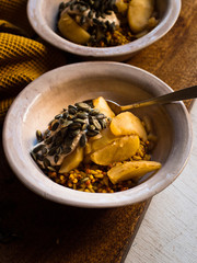 Rustic breakfast porridge with poached apple.